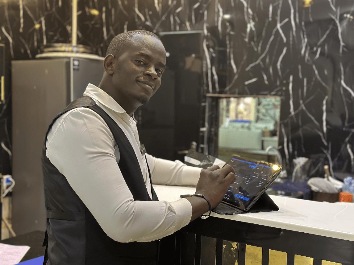 A host taking an order on an Edendox tablet POS